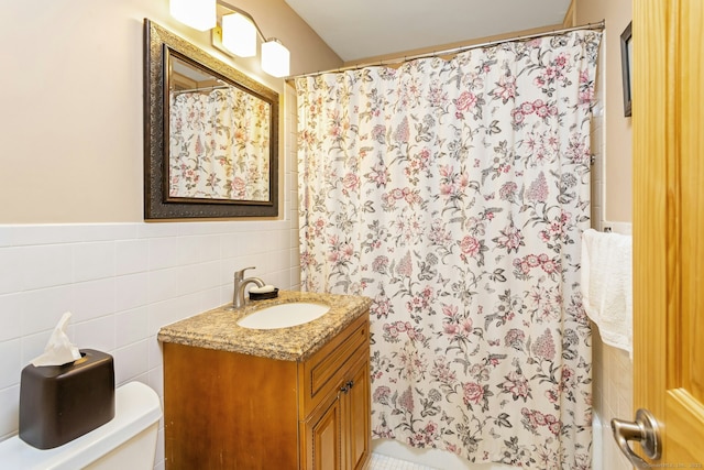 50 Glenbrook Rd Apt 7C, Stamford, CT 06902 - bathroom featuring tile walls, vanity, and curtained shower