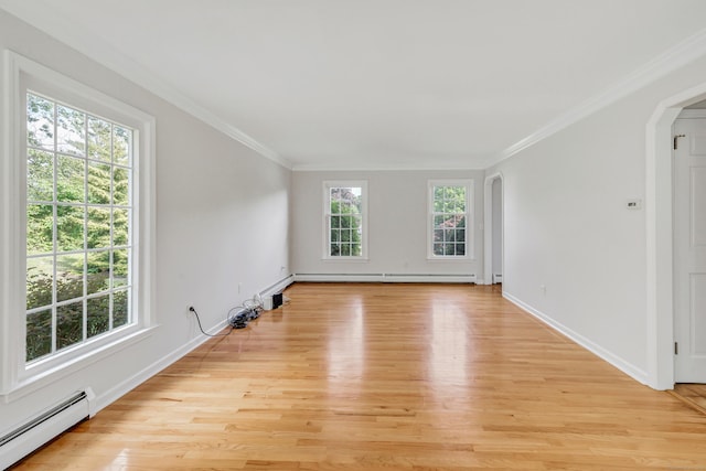 90 Chamberlain Dr, Shelton, CT 06484 - spare room featuring baseboard heating, arched walkways, light wood finished floors, ornamental molding, and a baseboard heating unit