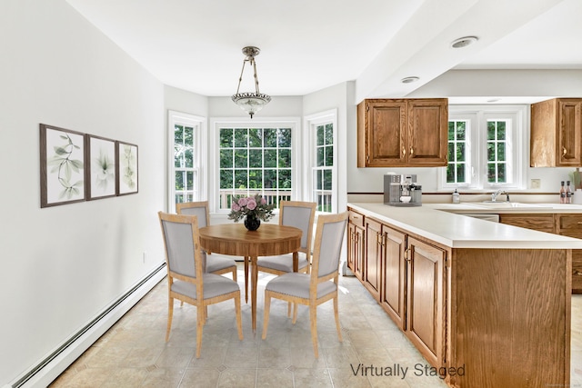 90 Chamberlain Dr, Shelton, CT 06484 - kitchen featuring a baseboard radiator, light countertops, brown cabinets, a peninsula, and pendant lighting