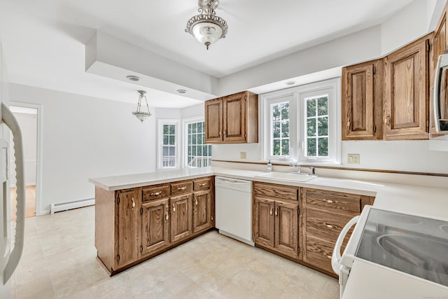 90 Chamberlain Dr, Shelton, CT 06484 - kitchen featuring white appliances, a peninsula, brown cabinetry, a baseboard radiator, and plenty of natural light