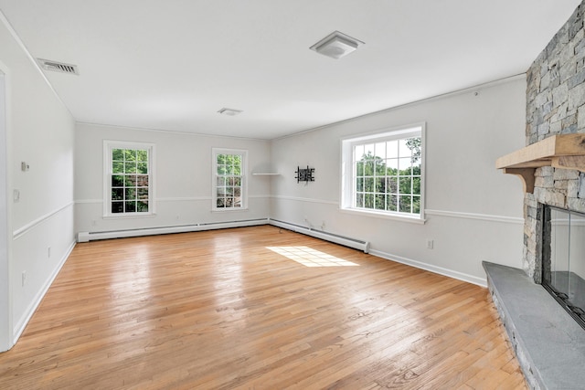 90 Chamberlain Dr, Shelton, CT 06484 - unfurnished living room with a fireplace, light wood finished floors, and baseboard heating