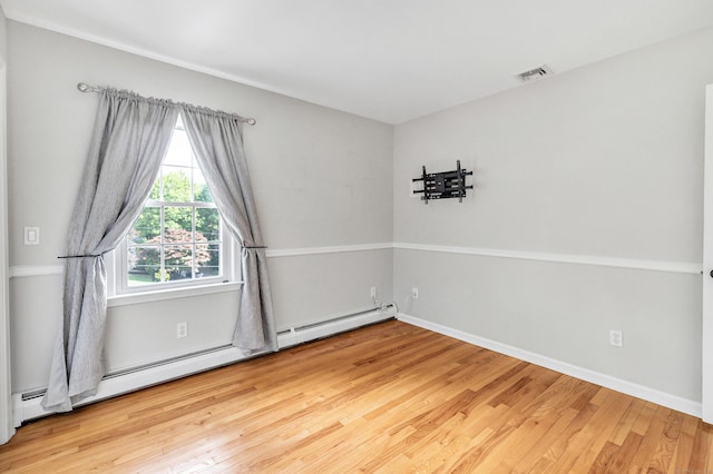 90 Chamberlain Dr, Shelton, CT 06484 - unfurnished room featuring wood finished floors and a baseboard heating unit