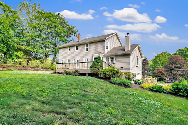 90 Chamberlain Dr, Shelton, CT 06484 - rear view of house featuring a chimney, a deck, and a yard