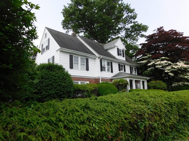 58 Edward St, East Haven, CT 06512 - view of front of property with a chimney