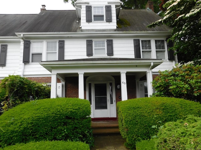 58 Edward St, East Haven, CT 06512 - view of front of property featuring a chimney and covered porch