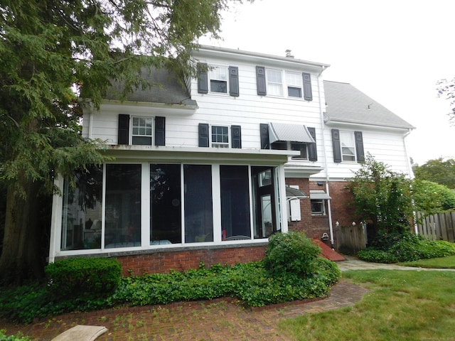 58 Edward St, East Haven, CT 06512 - view of front of property with a sunroom and brick siding