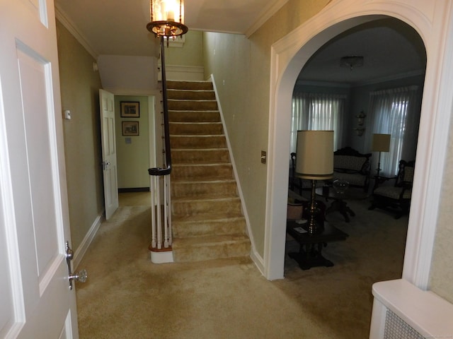 58 Edward St, East Haven, CT 06512 - stairway featuring carpet, ornamental molding, and arched walkways