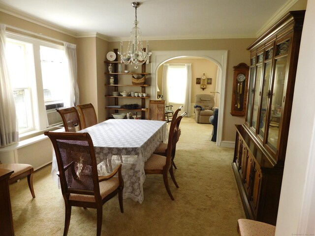 58 Edward St, East Haven, CT 06512 - dining area featuring arched walkways, light colored carpet, a chandelier, crown molding, and cooling unit