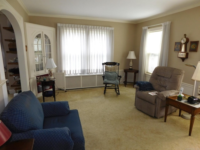 58 Edward St, East Haven, CT 06512 - carpeted living area with crown molding and arched walkways