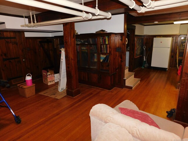 58 Edward St, East Haven, CT 06512 - finished below grade area featuring freestanding refrigerator, wood finished floors, and stairway