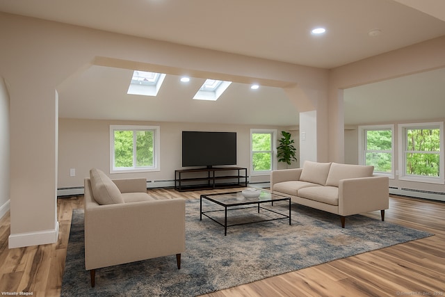 859 Ekonk Hill Rd, Voluntown, CT 06384 - living room with a skylight, a baseboard heating unit, lofted ceiling, plenty of natural light, and recessed lighting