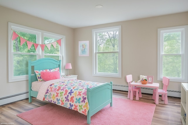 859 Ekonk Hill Rd, Voluntown, CT 06384 - bedroom featuring baseboard heating and wood finished floors
