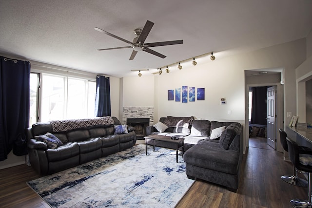 105 Little Oak Ln Unit 105, Rocky Hill, CT 06067 - living room featuring a ceiling fan, a fireplace, and dark wood-style flooring
