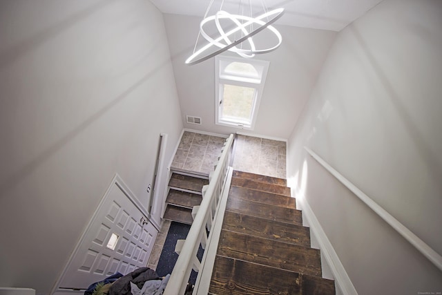 105 Little Oak Ln Unit 105, Rocky Hill, CT 06067 - stairs featuring vaulted ceiling and a chandelier