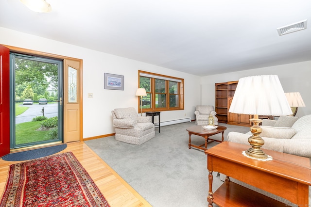 6 Old Sawmill Dr, Beacon Falls, CT 06403 - living room with a baseboard heating unit and wood finished floors