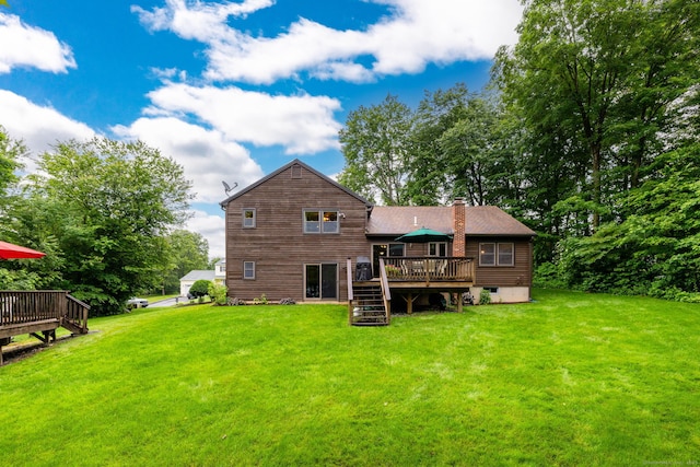 6 Old Sawmill Dr, Beacon Falls, CT 06403 - rear view of property with a deck, stairway, a chimney, and a lawn