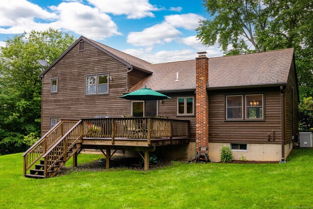 6 Old Sawmill Dr, Beacon Falls, CT 06403 - back of house with a yard, a chimney, a deck, and a shingled roof