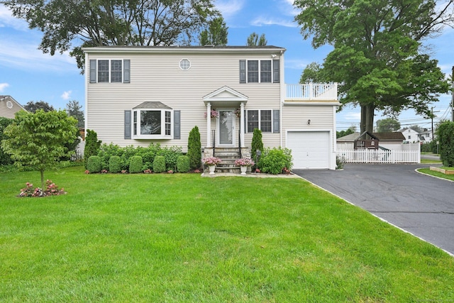 126 Sutton Dr E, Stamford, CT 06906 - colonial home featuring a balcony, asphalt driveway, and a garage