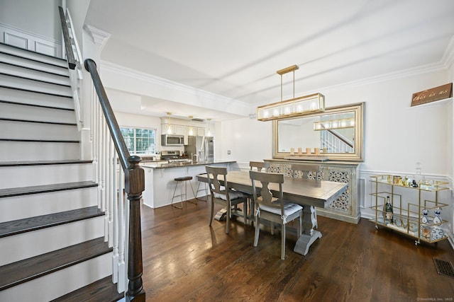 126 Sutton Dr E, Stamford, CT 06906 - dining space with ornamental molding, stairway, and dark wood finished floors