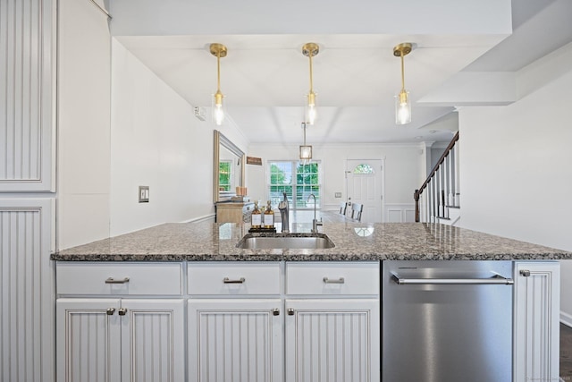 126 Sutton Dr E, Stamford, CT 06906 - kitchen featuring dishwasher, dark stone counters, white cabinetry, decorative light fixtures, and crown molding