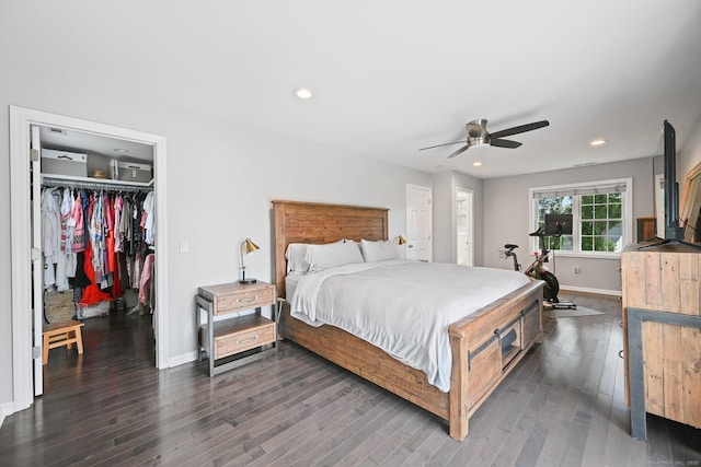 126 Sutton Dr E, Stamford, CT 06906 - bedroom with a walk in closet, dark wood-type flooring, recessed lighting, a ceiling fan, and a closet