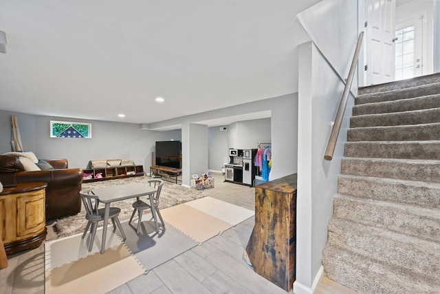 126 Sutton Dr E, Stamford, CT 06906 - living room featuring stairs, wood finished floors, and recessed lighting