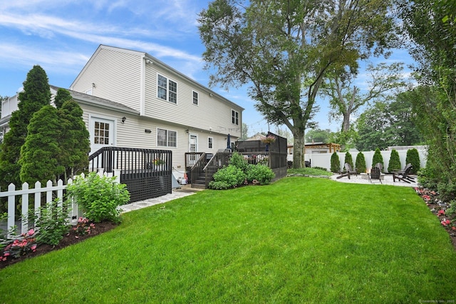 126 Sutton Dr E, Stamford, CT 06906 - rear view of house featuring a wooden deck and a patio area