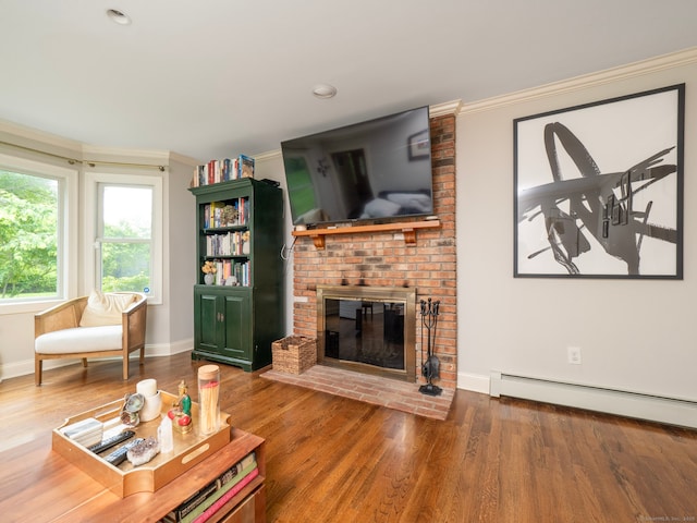 565 Danbury Rd, Wilton, CT 06897 - living room with ornamental molding, a baseboard heating unit, wood finished floors, a fireplace, and recessed lighting