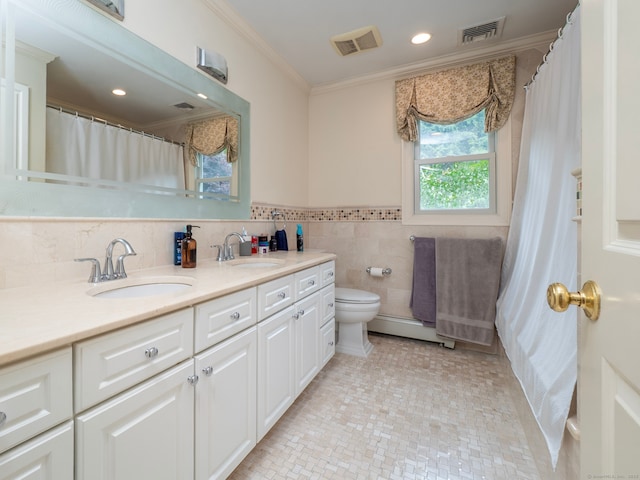 565 Danbury Rd, Wilton, CT 06897 - bathroom featuring a baseboard radiator, double vanity, crown molding, recessed lighting, and tile walls