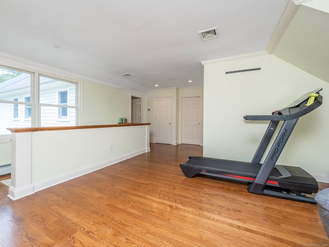 565 Danbury Rd, Wilton, CT 06897 - workout room featuring ornamental molding, wood finished floors, recessed lighting, and baseboard heating