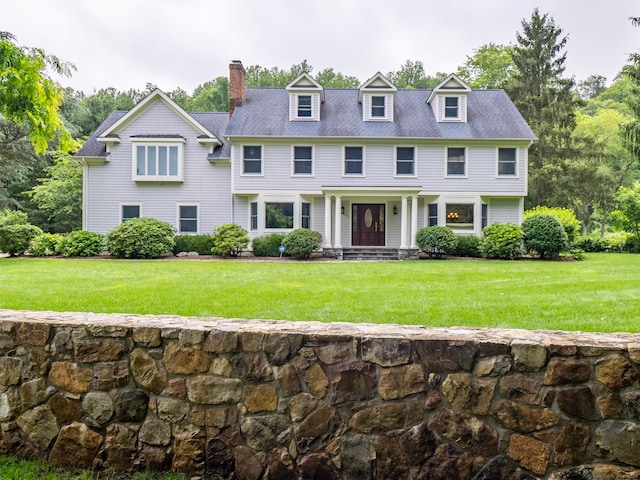 565 Danbury Rd, Wilton, CT 06897 - view of front of property with a chimney and a front lawn