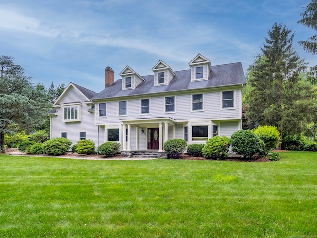 565 Danbury Rd, Wilton, CT 06897 - view of front of house featuring a front lawn and a chimney