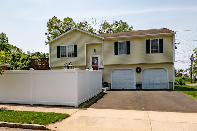 5 Pope St, New Haven, CT 06512 - split foyer home featuring asphalt driveway and a garage