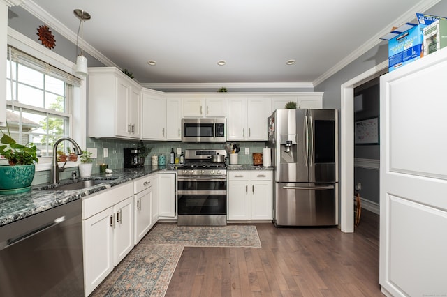 5 Pope St, New Haven, CT 06512 - kitchen featuring stainless steel appliances, dark wood finished floors, white cabinets, tasteful backsplash, and dark stone counters