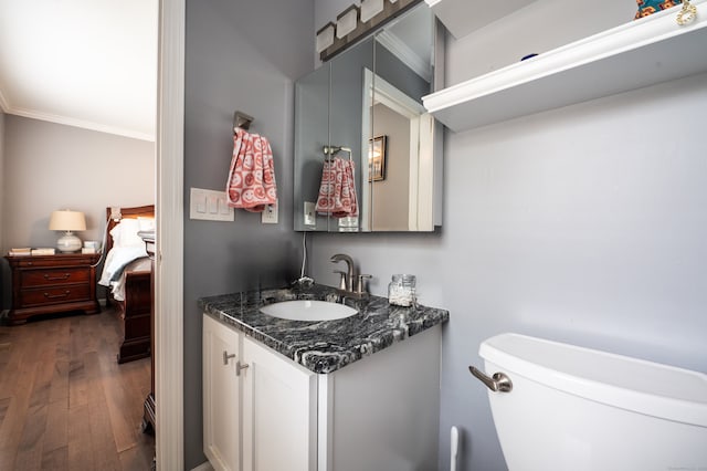 5 Pope St, New Haven, CT 06512 - half bathroom with crown molding, vanity, and wood finished floors