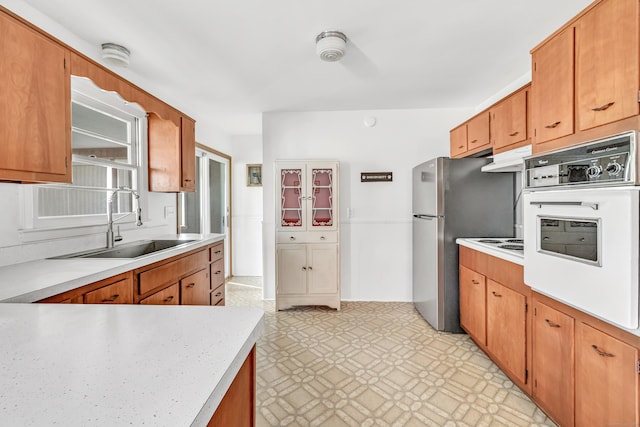 23 Laurel Wood Dr, Shelton, CT 06484 - kitchen featuring oven, freestanding refrigerator, light floors, and light countertops