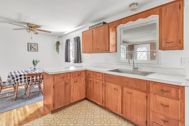 23 Laurel Wood Dr, Shelton, CT 06484 - kitchen with a peninsula, plenty of natural light, a ceiling fan, and light countertops