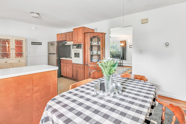 23 Laurel Wood Dr, Shelton, CT 06484 - dining area with a baseboard heating unit