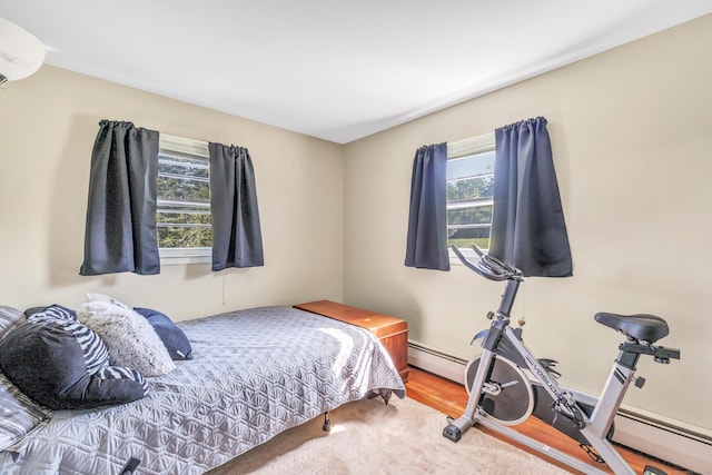 23 Laurel Wood Dr, Shelton, CT 06484 - bedroom with a baseboard heating unit and an AC wall unit