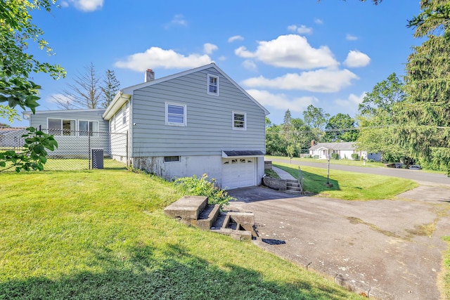23 Laurel Wood Dr, Shelton, CT 06484 - view of property exterior featuring driveway, an attached garage, and a chimney