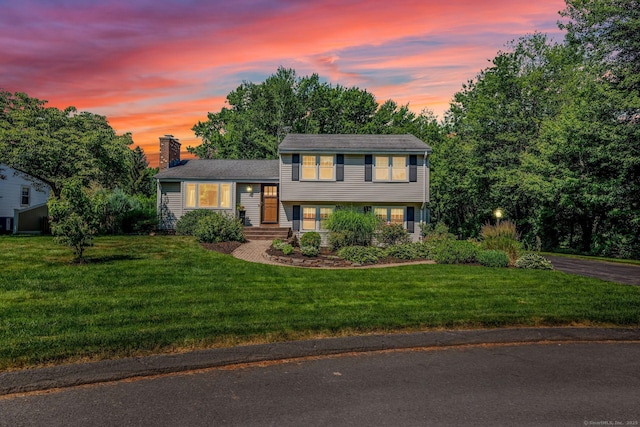 35 Twelve Acre Ln, Glastonbury, CT 06033 - split level home featuring a chimney and a lawn