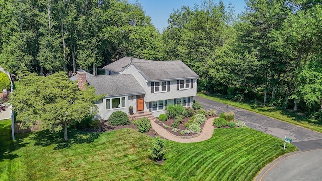 35 Twelve Acre Ln, Glastonbury, CT 06033 - tri-level home featuring a front lawn, a chimney, and roof with shingles