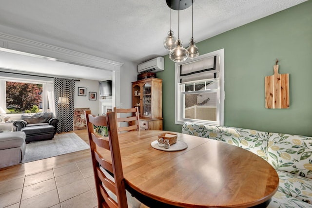 35 Twelve Acre Ln, Glastonbury, CT 06033 - dining space featuring a wall mounted AC, a textured ceiling, and tile patterned floors