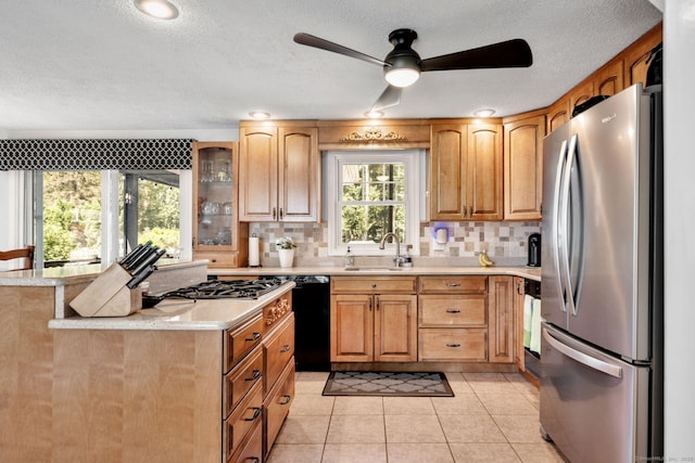 35 Twelve Acre Ln, Glastonbury, CT 06033 - kitchen featuring freestanding refrigerator, black dishwasher, light countertops, a ceiling fan, and decorative backsplash