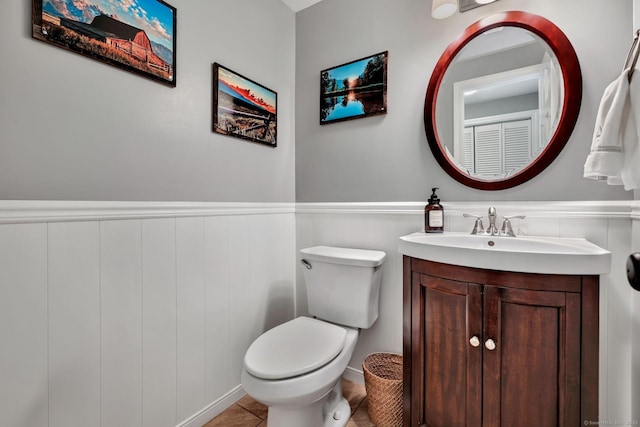 35 Twelve Acre Ln, Glastonbury, CT 06033 - bathroom featuring vanity, wainscoting, and tile patterned flooring