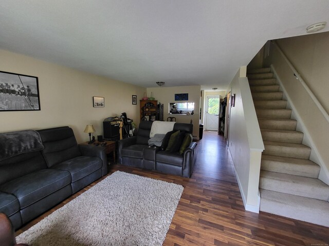 16 Seymour Rd Unit 9B, East Granby, CT 06026 - living room with dark wood-style floors and stairs