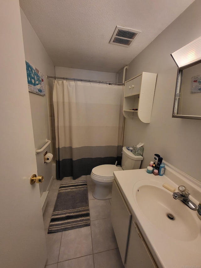 16 Seymour Rd Unit 9B, East Granby, CT 06026 - bathroom featuring vanity, tile patterned flooring, a textured ceiling, and a shower with shower curtain