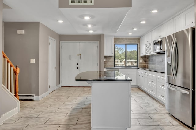 16 Pine Ct Unit 16, Cromwell, CT 06416 - kitchen with stainless steel appliances, a center island, decorative backsplash, white cabinets, and recessed lighting