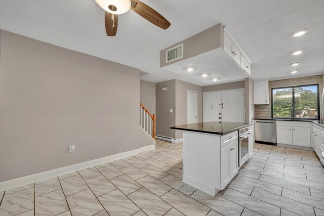 16 Pine Ct Unit 16, Cromwell, CT 06416 - kitchen with stainless steel dishwasher, dark countertops, a baseboard heating unit, backsplash, and recessed lighting