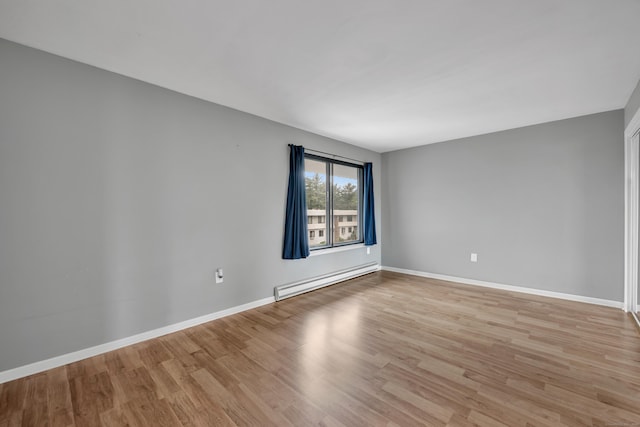 16 Pine Ct Unit 16, Cromwell, CT 06416 - spare room featuring a baseboard heating unit and light wood-type flooring